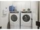 Convenient laundry room with modern washer and dryer, plus ample storage cabinets at 3221 Johnstowne St, Johns Island, SC 29455