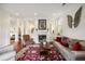 Elegant living room featuring a fireplace, plush seating, and decorative accents at 3221 Johnstowne St, Johns Island, SC 29455