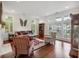 Bright living room with hardwood floors, large windows, and comfortable seating arrangement at 3221 Johnstowne St, Johns Island, SC 29455