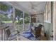 Relaxing screened porch with seating area and views of lush landscaping at 3221 Johnstowne St, Johns Island, SC 29455