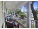 Relaxing covered porch with wicker furniture and serene neighborhood views at 3221 Johnstowne St, Johns Island, SC 29455
