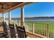 Enjoy stunning views from this inviting covered porch with rocking chairs and serene waterfront vistas at 3221 Johnstowne St, Johns Island, SC 29455