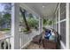 Relaxing covered porch with wicker furniture and serene neighborhood views at 3221 Johnstowne St, Johns Island, SC 29455
