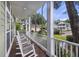Inviting porch with rocking chairs offers a relaxing outdoor space to enjoy the neighborhood at 3221 Johnstowne St, Johns Island, SC 29455