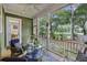 Inviting screened porch with comfortable seating and views of the lush backyard at 3221 Johnstowne St, Johns Island, SC 29455