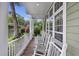 Inviting front porch with rocking chairs offers a relaxing outdoor space to enjoy neighborhood views at 3221 Johnstowne St, Johns Island, SC 29455