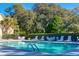 Inviting community swimming pool with lounge chairs, tables, and lush landscaping for relaxation and leisure at 3221 Johnstowne St, Johns Island, SC 29455