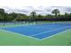 Well-maintained tennis courts with green and blue surfaces, ready for recreational play in a sunny setting at 3221 Johnstowne St, Johns Island, SC 29455