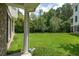 Expansive backyard featuring lush green grass and mature trees, creating a serene outdoor space at 3616 Bagley Dr, Mount Pleasant, SC 29466