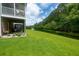 Backyard view with lush green lawn and pond view from the home's outdoor living space at 3616 Bagley Dr, Mount Pleasant, SC 29466