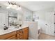 Bright bathroom with double vanity, soaking tub, large mirror, wood cabinets and walk-in shower at 3616 Bagley Dr, Mount Pleasant, SC 29466