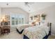 Cozy bedroom with twin beds, plantation shutters, and quaint decor with matching floral bedding at 3616 Bagley Dr, Mount Pleasant, SC 29466