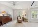 Bright bedroom featuring plantation shutters, a ceiling fan, and cozy decor at 3616 Bagley Dr, Mount Pleasant, SC 29466