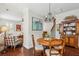 Dining area featuring a wood table, chandelier, and view into the living room at 3616 Bagley Dr, Mount Pleasant, SC 29466