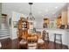 Dining area with hardwood floors, an antique hutch and a chandelier at 3616 Bagley Dr, Mount Pleasant, SC 29466