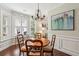 Dining area with a round wood table and a decorative chandelier at 3616 Bagley Dr, Mount Pleasant, SC 29466