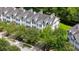 Exterior shot of a townhouse with black shutters, a small tree, and a nearby car at 3616 Bagley Dr, Mount Pleasant, SC 29466