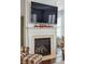 Living room fireplace featuring a mounted television and decorative mantel at 3616 Bagley Dr, Mount Pleasant, SC 29466