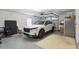 Clean garage featuring a parked vehicle, durable epoxy flooring, and storage solutions at 3616 Bagley Dr, Mount Pleasant, SC 29466