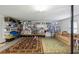 Spacious garage with organized storage, a seating area, and a durable epoxy floor at 3616 Bagley Dr, Mount Pleasant, SC 29466