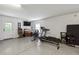 Garage area with exercise equipment, a TV setup, and access to the outdoors at 3616 Bagley Dr, Mount Pleasant, SC 29466