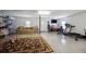 Spacious garage featuring a sofa, gym equipment, and durable epoxy flooring at 3616 Bagley Dr, Mount Pleasant, SC 29466