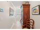 Hallway showcasing neutral walls, neutral tile, an armoire and decorative elements at 3616 Bagley Dr, Mount Pleasant, SC 29466