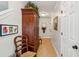 Hallway featuring neutral walls, a large armoire and neutral tiled flooring at 3616 Bagley Dr, Mount Pleasant, SC 29466