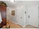 Hallway with neutral walls, tile floors, detailed trim, and white doors at 3616 Bagley Dr, Mount Pleasant, SC 29466