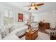 Bright and airy living room with a ceiling fan, wood floors and white sofas at 3616 Bagley Dr, Mount Pleasant, SC 29466