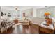 Bright living room featuring hardwood floors, neutral furniture, shutters and decorative elements at 3616 Bagley Dr, Mount Pleasant, SC 29466