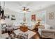 Bright living room featuring hardwood floors, neutral furniture, shutters and decorative elements at 3616 Bagley Dr, Mount Pleasant, SC 29466