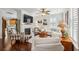 Bright living room featuring a fireplace, ceiling fan, wood floors, and white sofas at 3616 Bagley Dr, Mount Pleasant, SC 29466