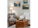 Cozy living room area with a wood chest, stylish chair, and charming wall art at 3616 Bagley Dr, Mount Pleasant, SC 29466