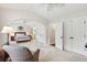 Large bedroom featuring vaulted ceiling, neutral carpet, and arched doorway at 3616 Bagley Dr, Mount Pleasant, SC 29466