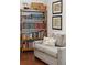 Close up of an office featuring bookshelves, a sofa, and attractive wall art at 3616 Bagley Dr, Mount Pleasant, SC 29466