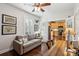 Comfortable office space adjacent to the kitchen, featuring a sofa, desk, and chair at 3616 Bagley Dr, Mount Pleasant, SC 29466