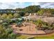Well-maintained community playground featuring modern equipment, mature trees, and attractive landscaping at 3616 Bagley Dr, Mount Pleasant, SC 29466