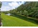 Scenic view of a pond with a fountain surrounded by lush greenery and trees at 3616 Bagley Dr, Mount Pleasant, SC 29466