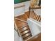 Staircase with hardwood stairs and white risers offering classic style and design at 3616 Bagley Dr, Mount Pleasant, SC 29466