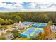 Aerial view of community tennis courts surrounded by trees, near residential buildings at 3616 Bagley Dr, Mount Pleasant, SC 29466
