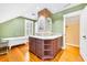 Charming bathroom with double vanity, exposed brick accent, and a classic clawfoot tub at 406 S Gum St, Summerville, SC 29483