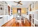 Stylish dining room with built-in cabinets, large windows, and a dining table, ideal for Gathering meals and gatherings at 406 S Gum St, Summerville, SC 29483