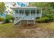 Beautiful two-story house with a spacious front porch and well-maintained yard at 406 S Gum St, Summerville, SC 29483