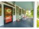 Charming front porch featuring rocking chairs and decorative details, perfect for enjoying peaceful moments at 406 S Gum St, Summerville, SC 29483