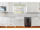 Bright kitchen featuring stainless steel appliances and plenty of counter space at 406 S Gum St, Summerville, SC 29483