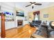 Cozy living room with a fireplace, built-in bookshelves, and comfortable seating, perfect for relaxing and entertaining at 406 S Gum St, Summerville, SC 29483