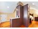 Bedroom featuring unique design elements like a partial wall, hardwood floors, and a king bed at 406 S Gum St, Summerville, SC 29483