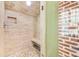 Tiled shower showcasing a built-in bench and decorative stone floor at 406 S Gum St, Summerville, SC 29483