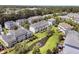 Aerial view of community houses, lawns, and a pond with fountain feature at 4060 Hartland St, Charleston, SC 29414